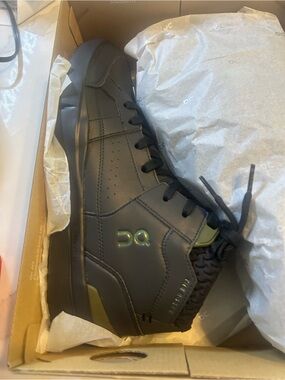On Running Men’s Black Leather High-Top Sneaker with Olive Accents